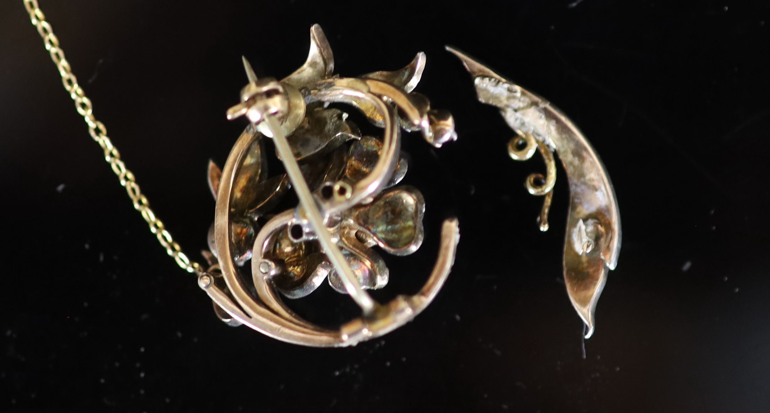 A 19th century gold, silver and rose cut diamond set foliate scroll brooch (a.f.)